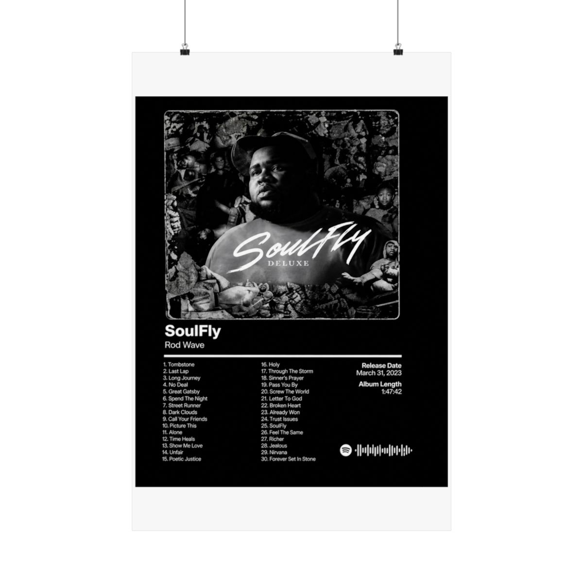 A framed black and white poster of the "SoulFly Deluxe" album by Rod Wave. The poster displays the album title, artist, tracklist, release date, and album length. The image is set against a dark...